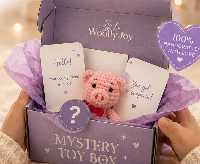 Purple WoollyJoy mystery toy box with a pink pig toy